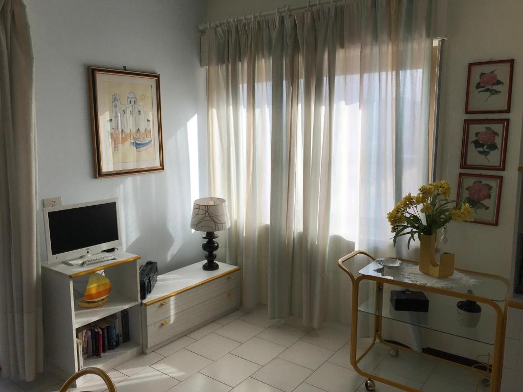 Televízia a/alebo spoločenská miestnosť v ubytovaní Casa del Sole