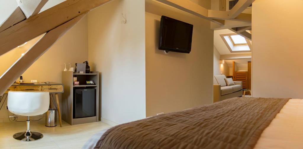 Postel nebo postele na pokoji v ubytování Hotel Jean Moët