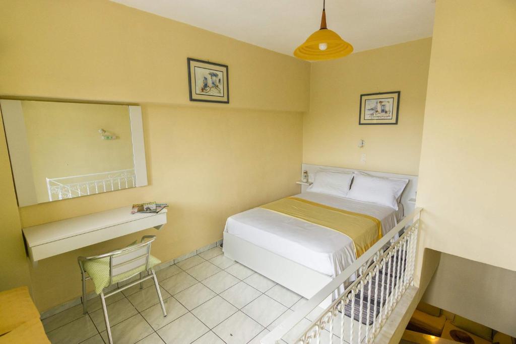 Postel nebo postele na pokoji v ubytování Stathopoulos Apartments