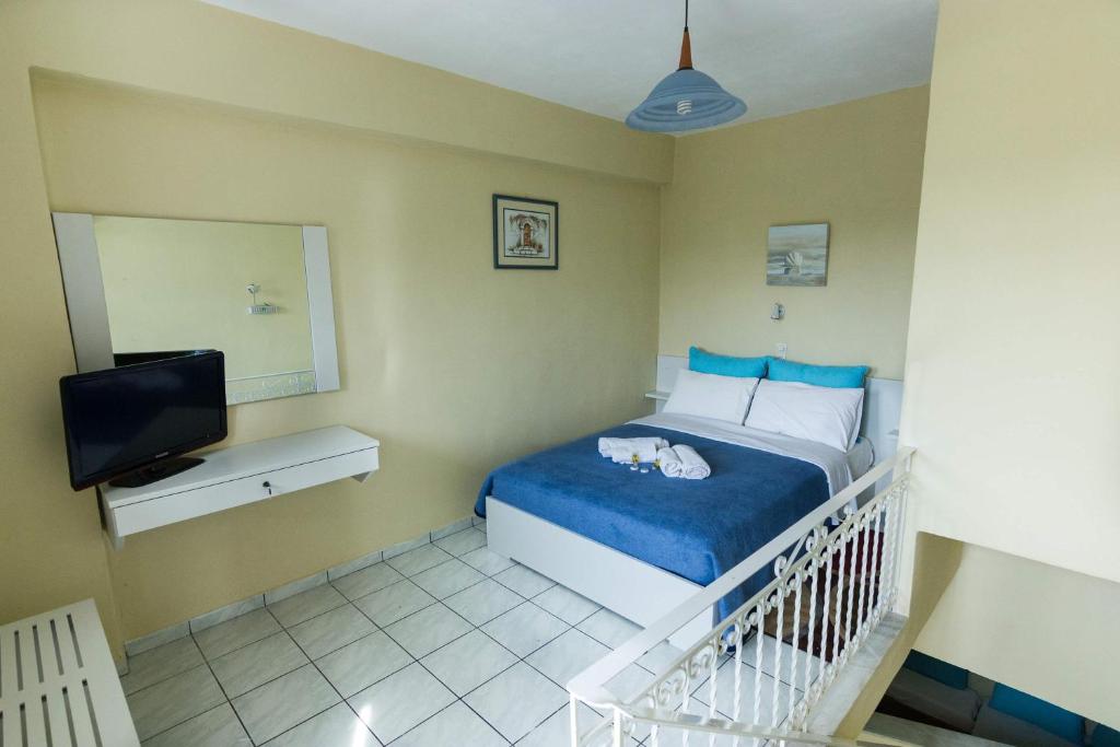 Postel nebo postele na pokoji v ubytování Stathopoulos Apartments