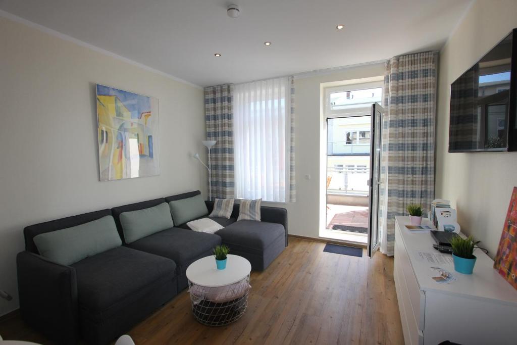 Posezení v ubytování Ferienwohnung in Warnemünde, Friedrich-Franz-Straße 11