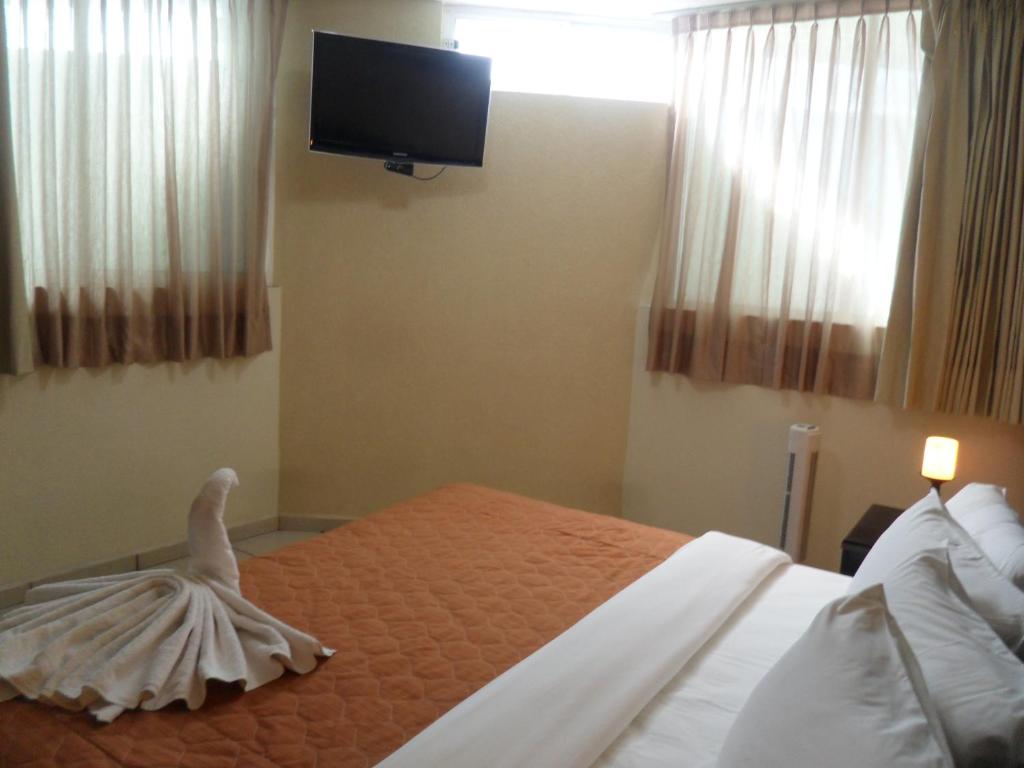 Postel nebo postele na pokoji v ubytování Hotel Suite Azomali