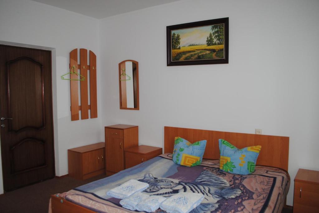 Postel nebo postele na pokoji v ubytování Hotel - restaurant "Lion's heart"