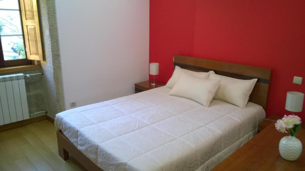 Postel nebo postele na pokoji v ubytování Casa das Neves
