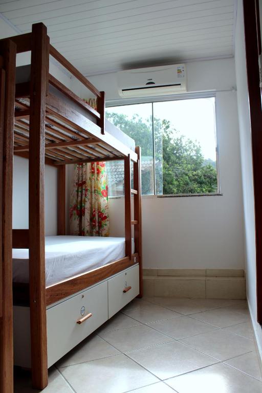 Postel nebo postele na pokoji v ubytování Beira Mar Hostel & Suítes