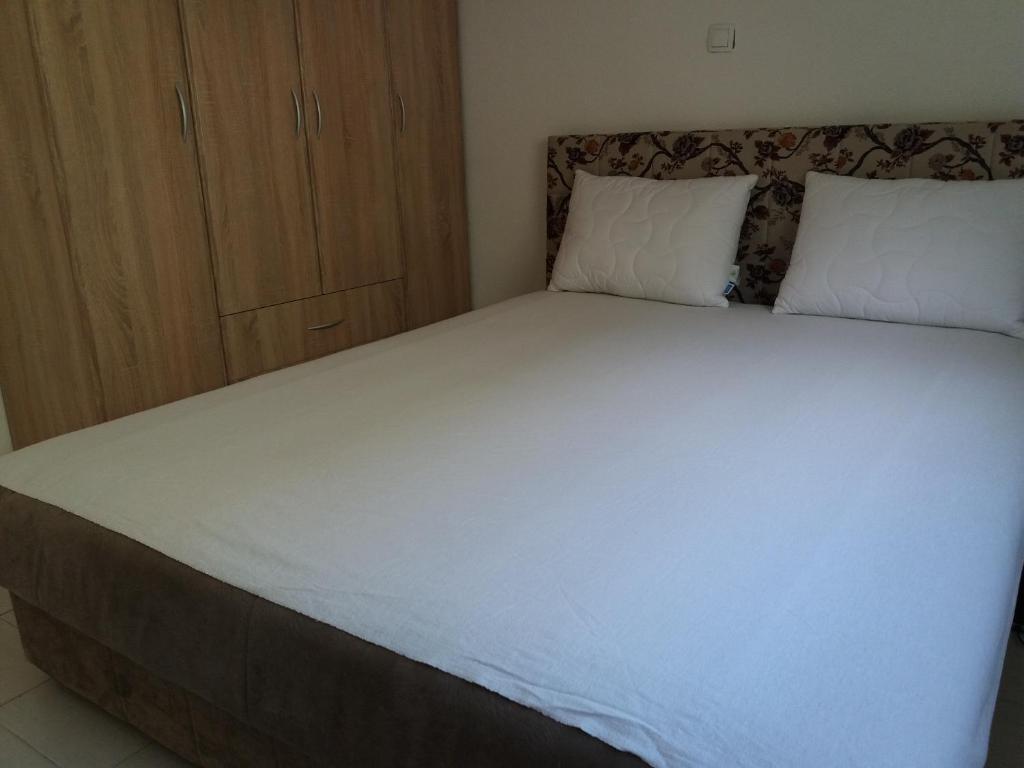 Postel nebo postele na pokoji v ubytování Apartments Dragan