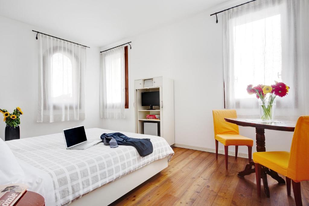 Postel nebo postele na pokoji v ubytování Hotel Due Mori