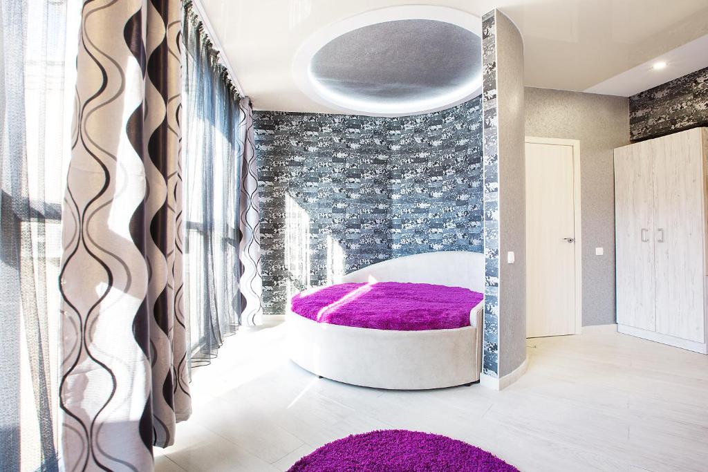 Postel nebo postele na pokoji v ubytování Sumskaya ApartHotel
