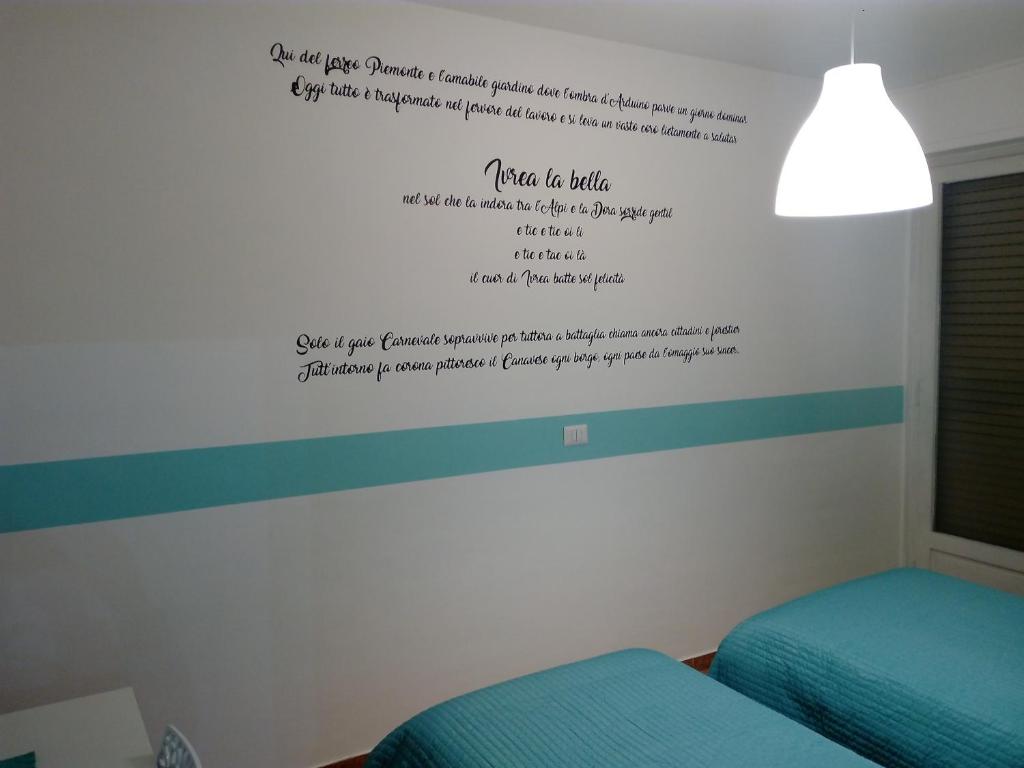 Postel nebo postele na pokoji v ubytování Ivrea la Bella