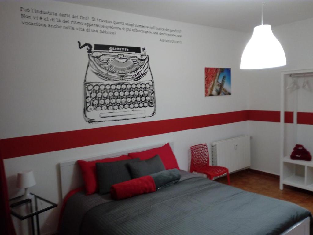 Postel nebo postele na pokoji v ubytování Ivrea la Bella