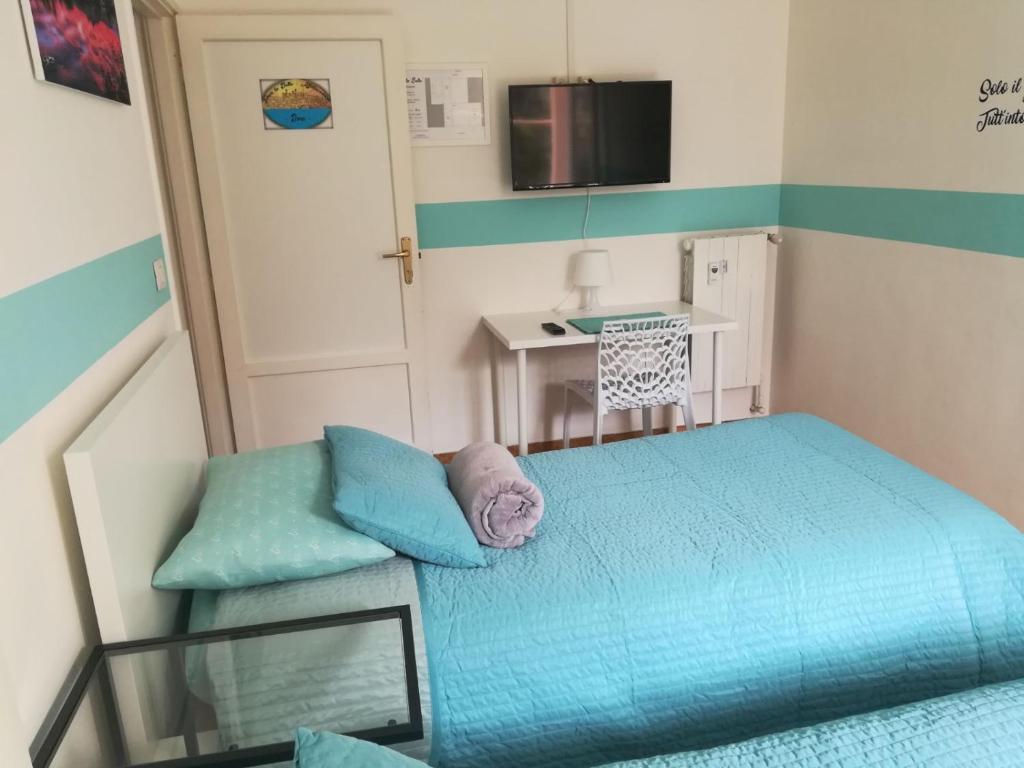 Postel nebo postele na pokoji v ubytování Ivrea la Bella