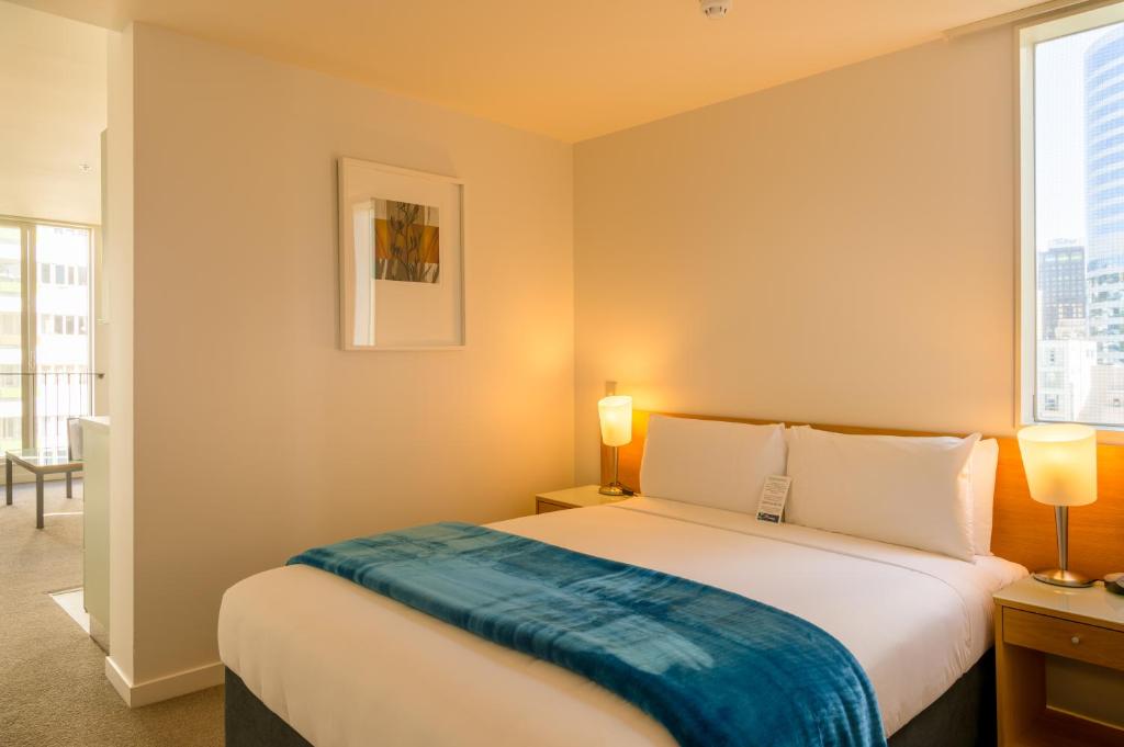 Postel nebo postele na pokoji v ubytování Astelia Apartment Hotel