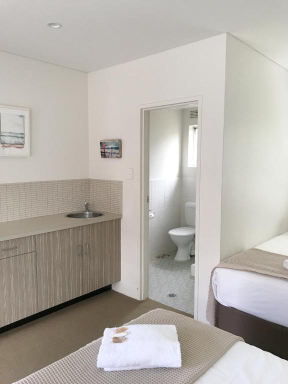 Postel nebo postele na pokoji v ubytování Thirroul Beach Motel