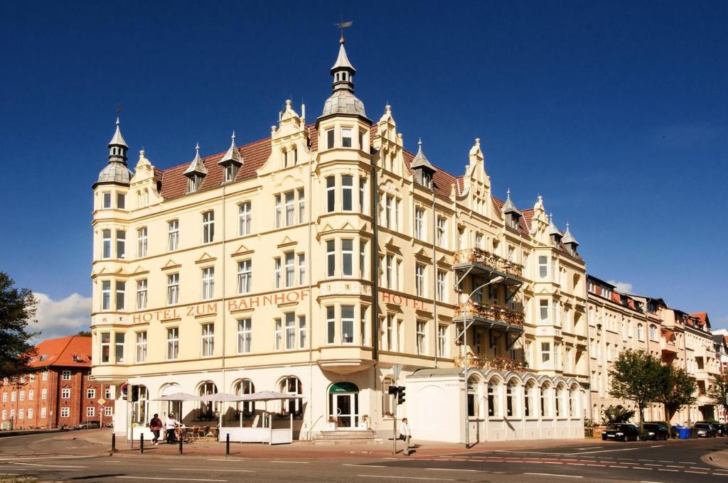 a large building with a clock on the front of it at Hotel Stralsund in Stralsund