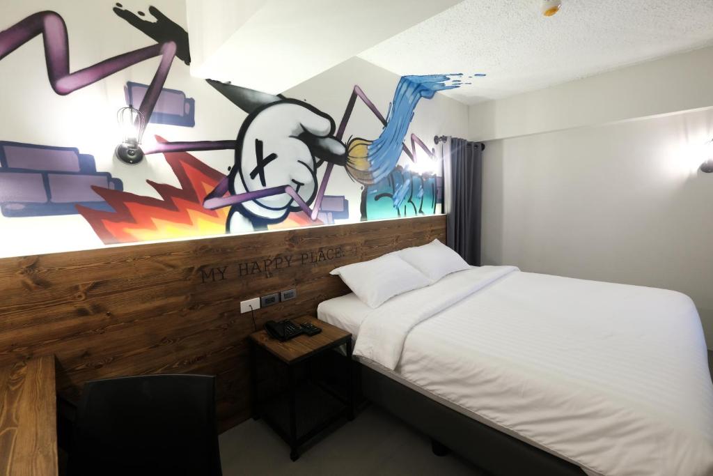 Postel nebo postele na pokoji v ubytování U Hotels Makati
