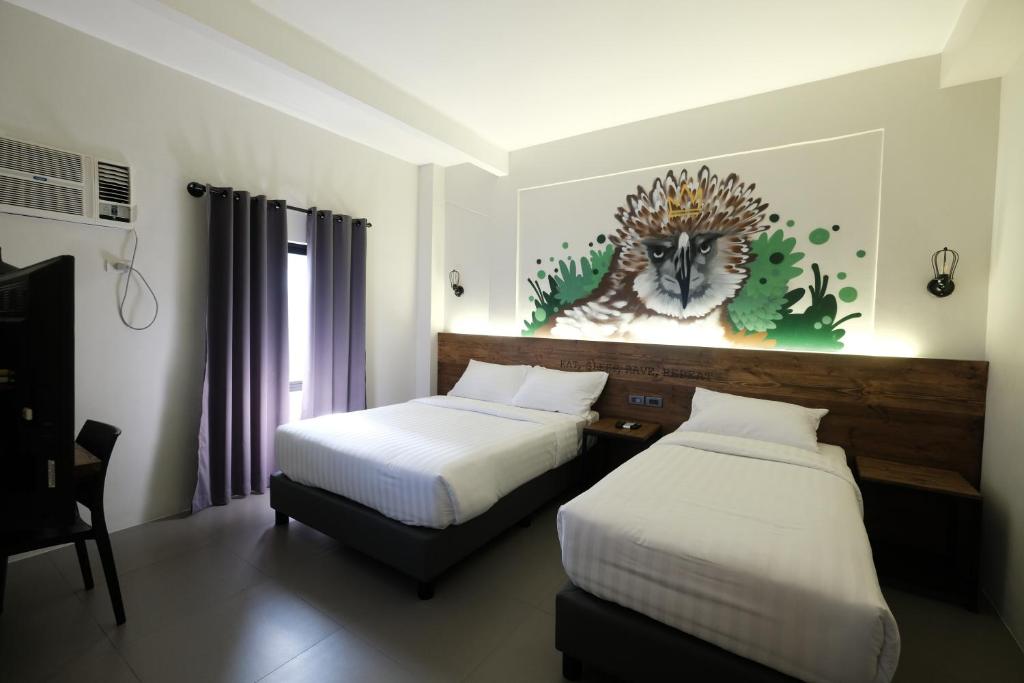 Postel nebo postele na pokoji v ubytování U Hotels Makati
