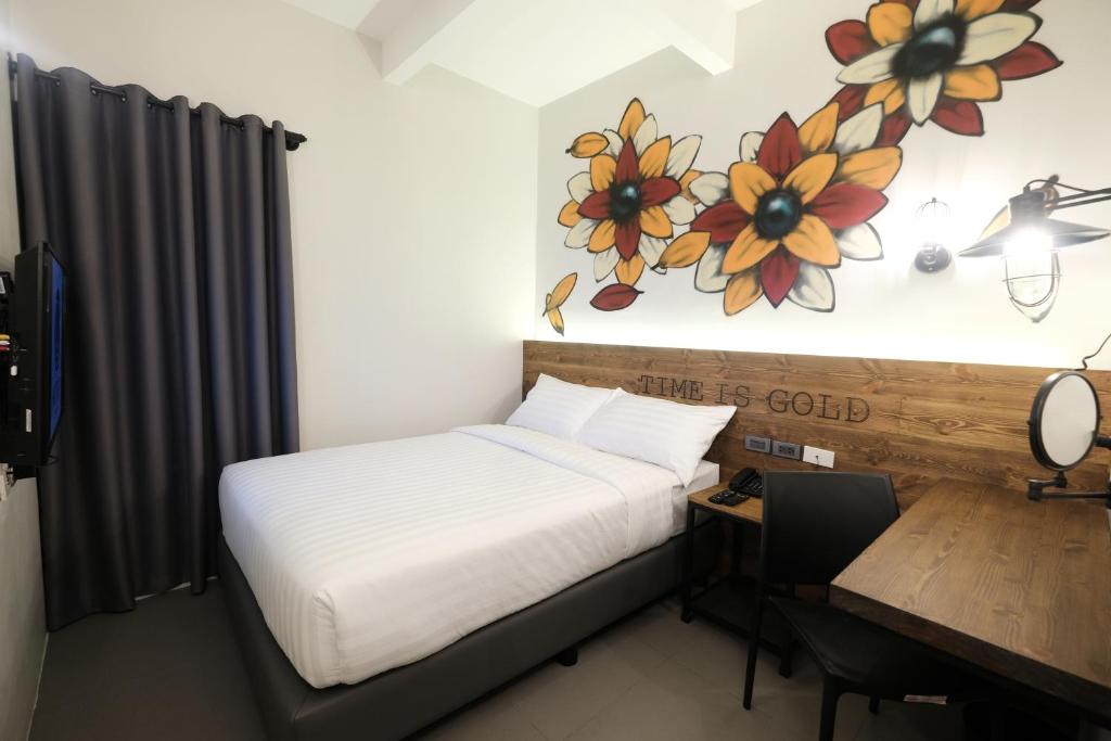 Postel nebo postele na pokoji v ubytování U Hotels Makati