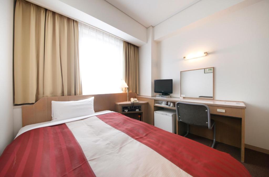 TV a/nebo společenská místnost v ubytování Hotel Nagano Avenue