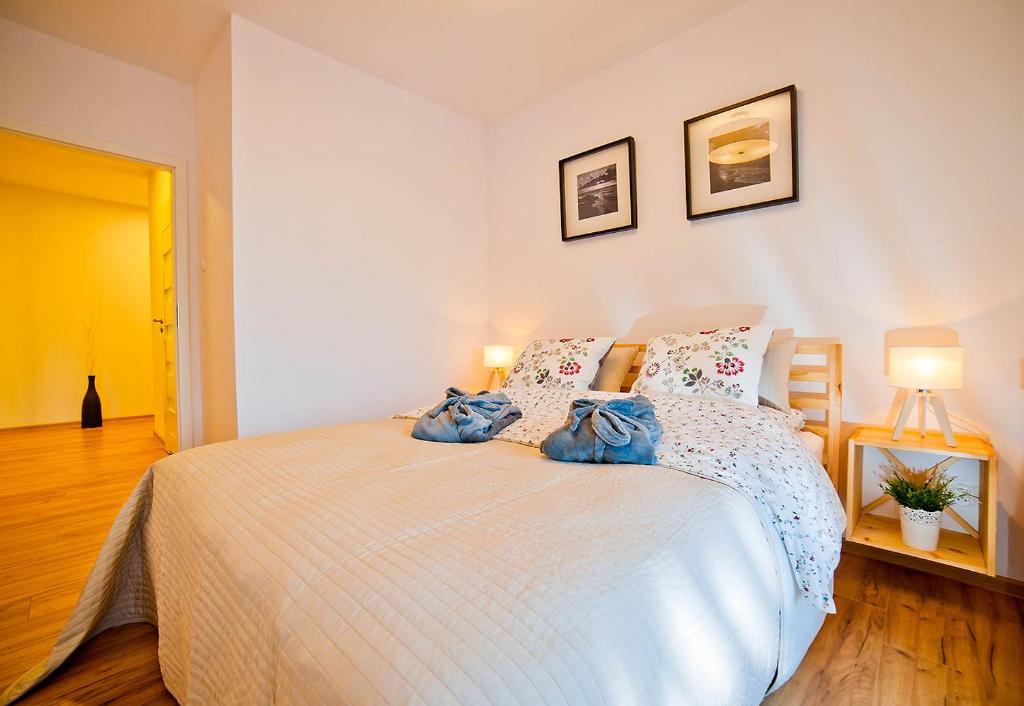 Posteľ alebo postele v izbe v ubytovaní Aqua Holiday Apartments Beach#Pool#Sauna no limit