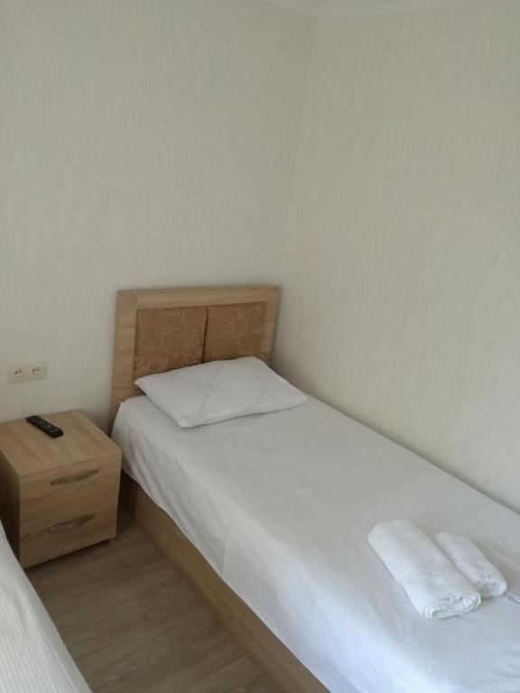 Postel nebo postele na pokoji v ubytování Guest House Imereti
