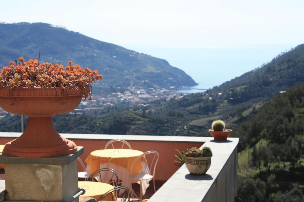a balcony with a vase with flowers on it at L'Antico Borgo B&B in Levanto