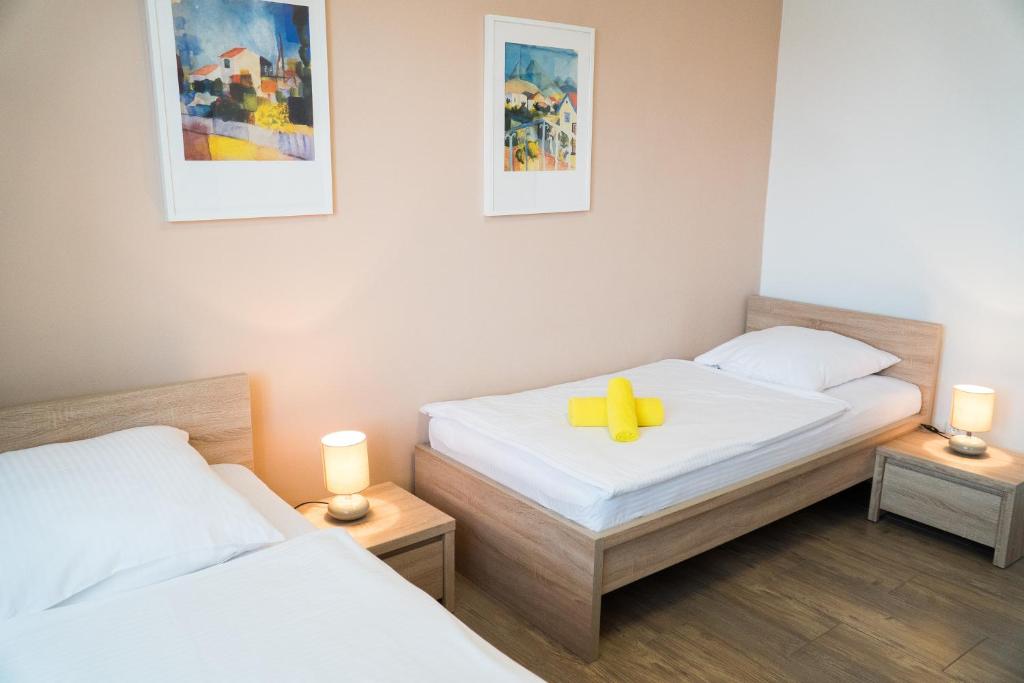 Postel nebo postele na pokoji v ubytování Penzion Staré Louny
