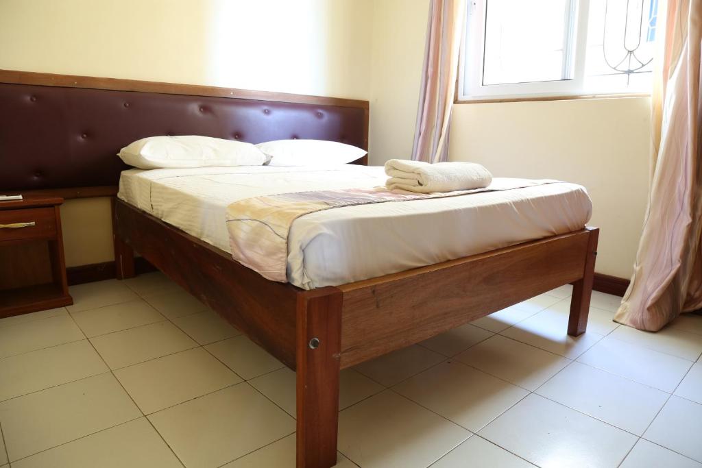 Postel nebo postele na pokoji v ubytování Prestige Leisure Hotel