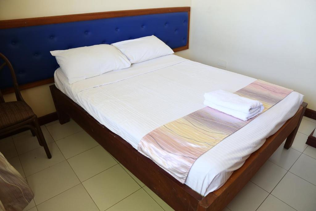 Postel nebo postele na pokoji v ubytování Prestige Leisure Hotel