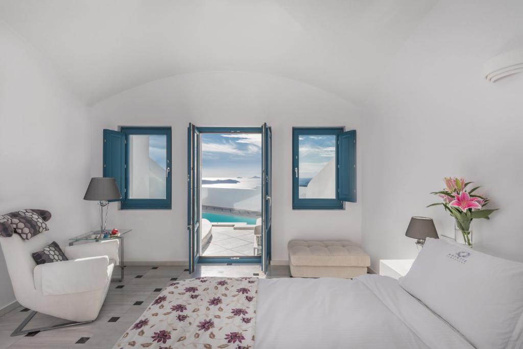 Postel nebo postele na pokoji v ubytování Anteliz Suites