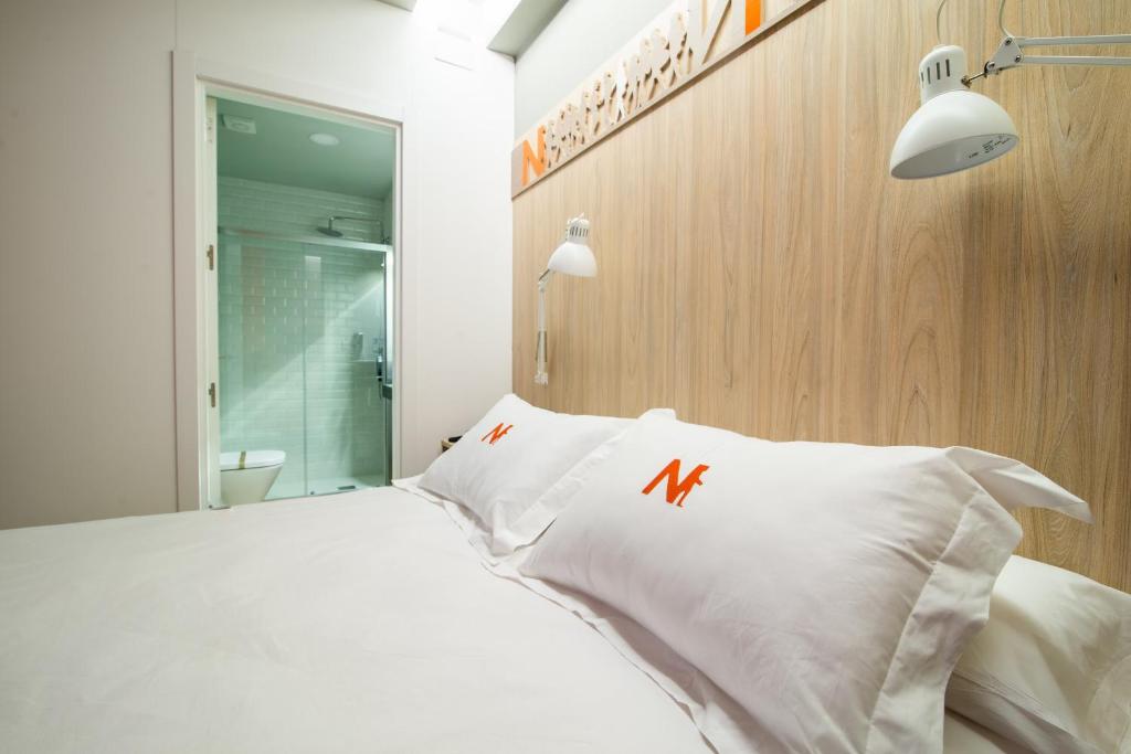 Voodi või voodid majutusasutuse Hotel Nomada toas