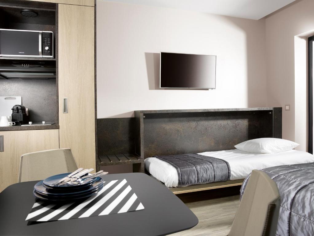 Postel nebo postele na pokoji v ubytování One Loft Appart