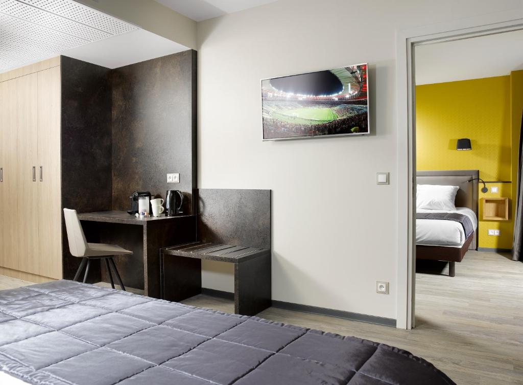 Postel nebo postele na pokoji v ubytování One Loft Appart