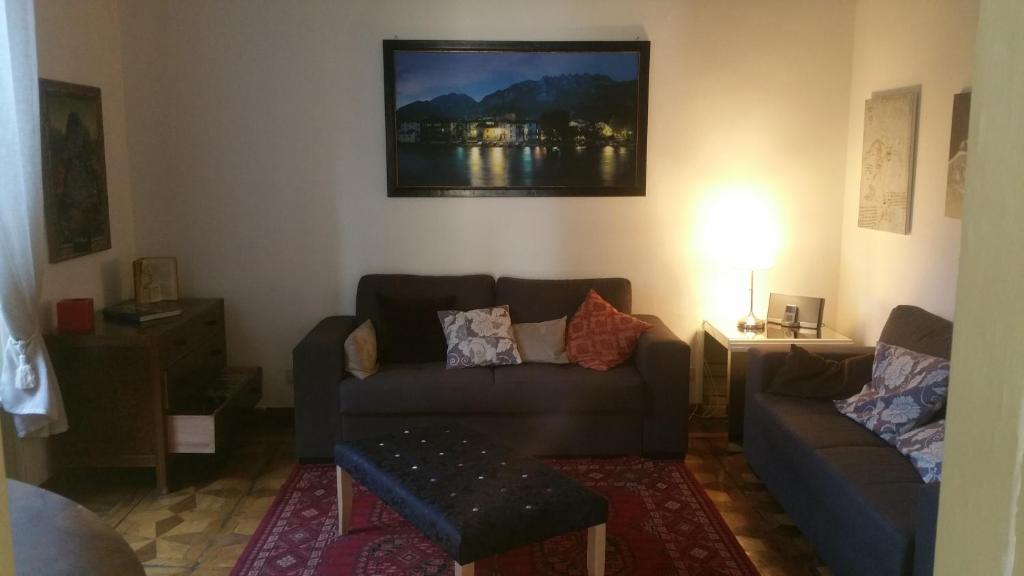 a living room with a couch and a table at Villa del Cigno in Lecco