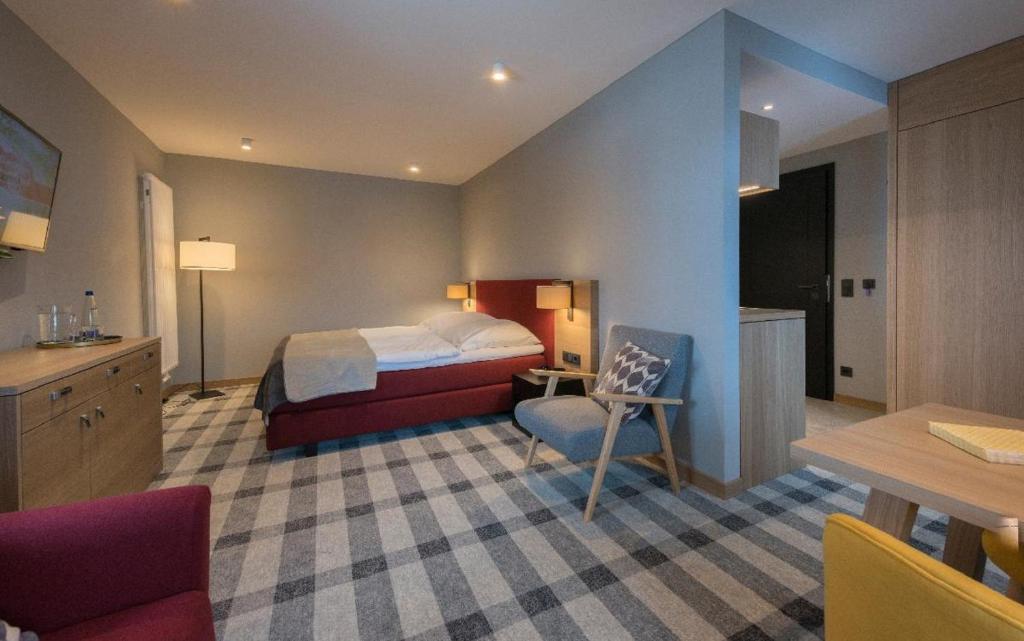 Postel nebo postele na pokoji v ubytování Gasthaus - Hotel FUCHS