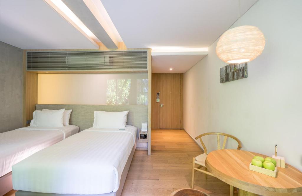 Postel nebo postele na pokoji v ubytování Ad Lib Hotel Bangkok