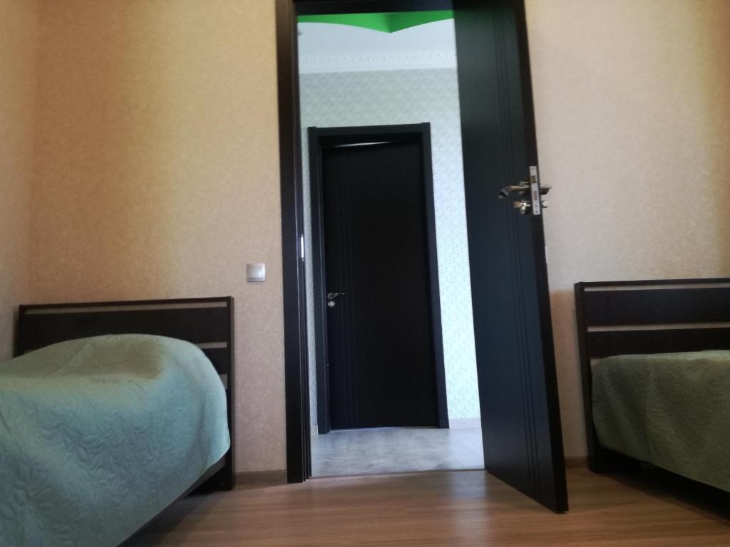 Postel nebo postele na pokoji v ubytování Guest House Kakheti