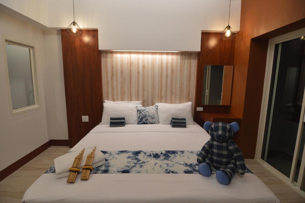 Postel nebo postele na pokoji v ubytování UD Capital Hotel
