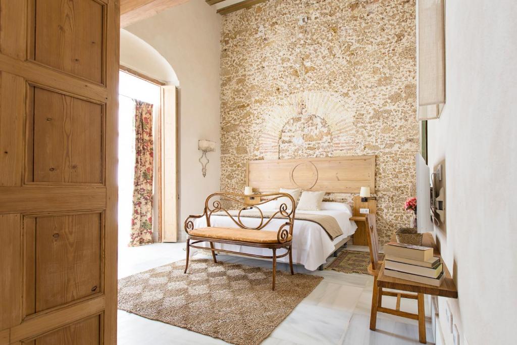 Posteľ alebo postele v izbe v ubytovaní Hotel Casa de las Cuatro Torres
