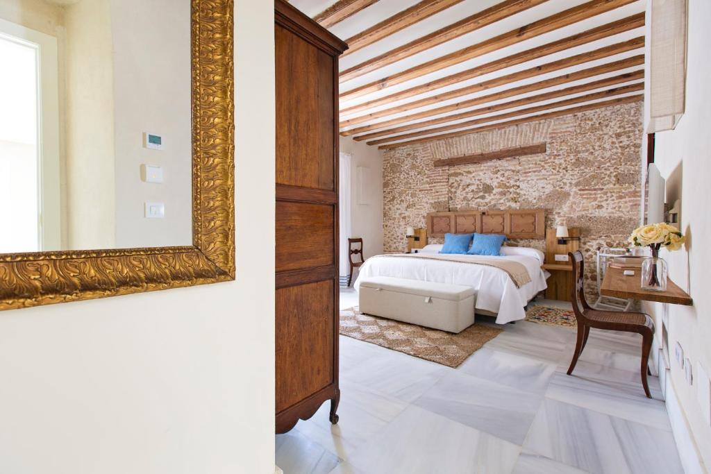 Posteľ alebo postele v izbe v ubytovaní Hotel Casa de las Cuatro Torres