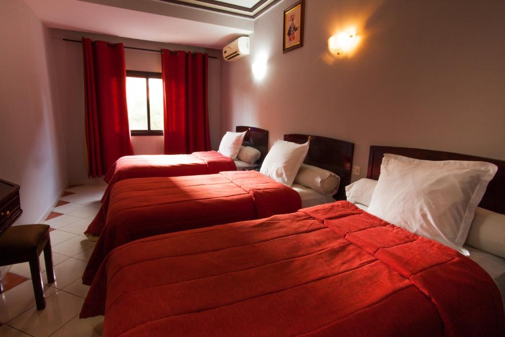 Postel nebo postele na pokoji v ubytování Residence Hotel Assounfou