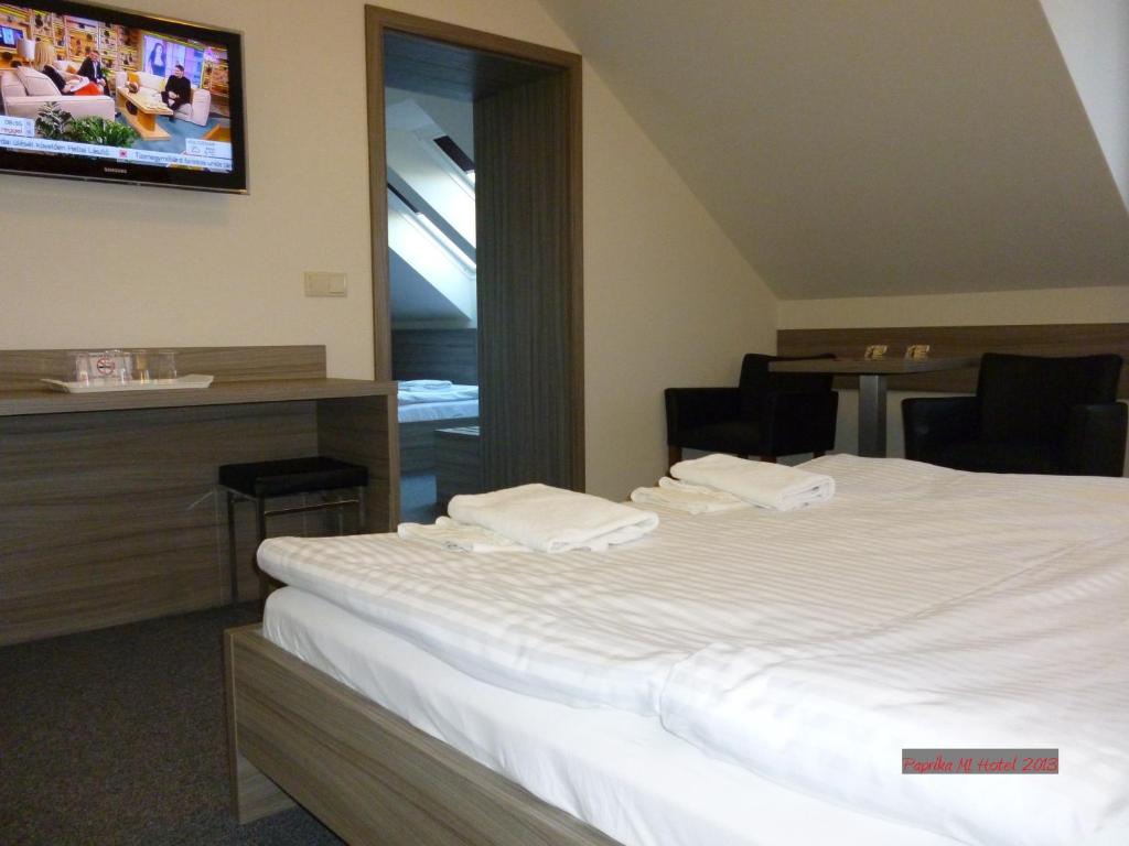 Postel nebo postele na pokoji v ubytování Paprika M1 Hotel