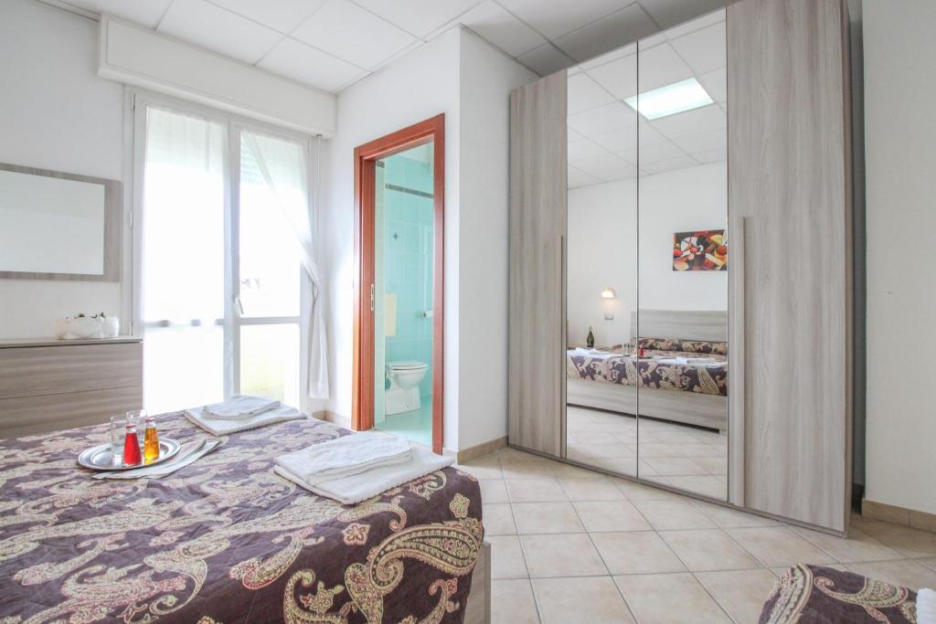 Łóżko lub łóżka w pokoju w obiekcie Residence Eurogarden