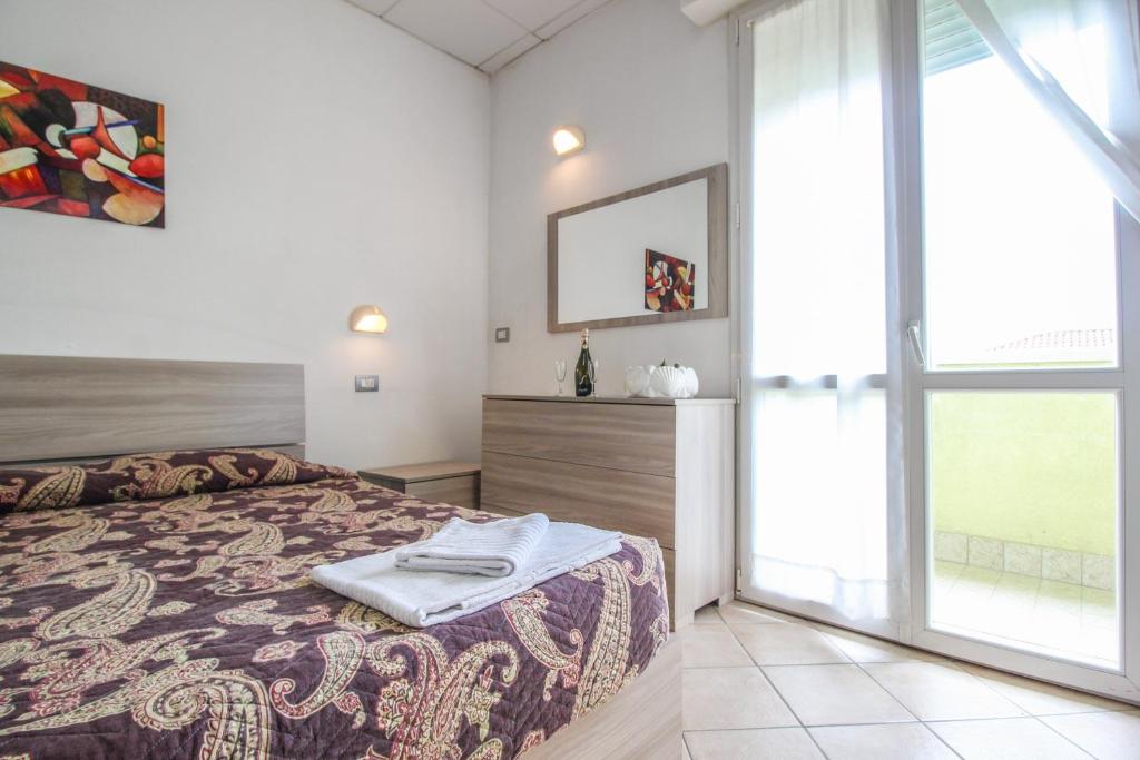 Łóżko lub łóżka w pokoju w obiekcie Residence Eurogarden