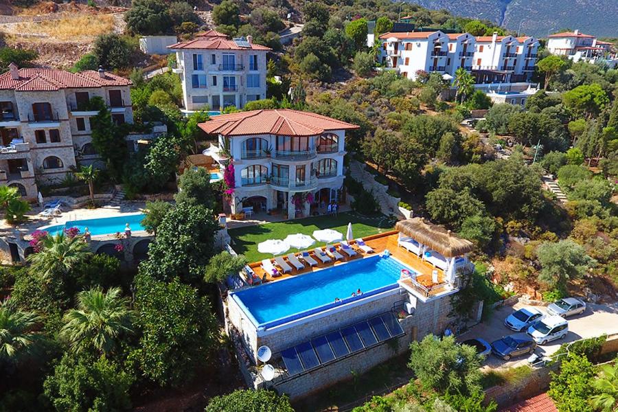 an aerial view of a house with a swimming pool at Hotel Marsala in Kas