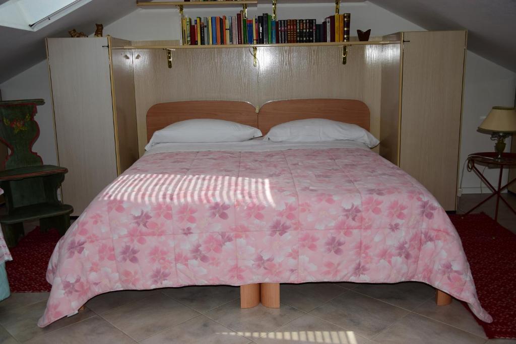 Postel nebo postele na pokoji v ubytování B&B Il Glicine Fiorito