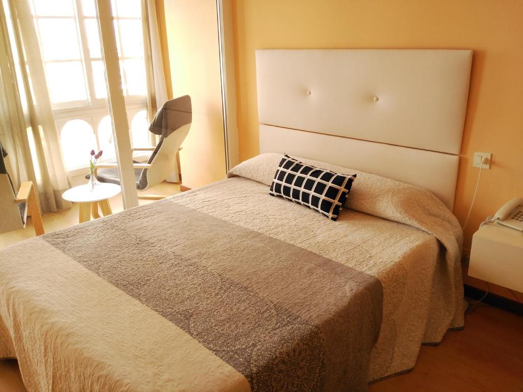 Posteľ alebo postele v izbe v ubytovaní Hotel Cais
