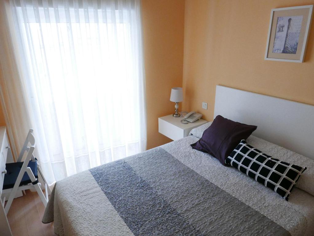 Posteľ alebo postele v izbe v ubytovaní Hotel Cais