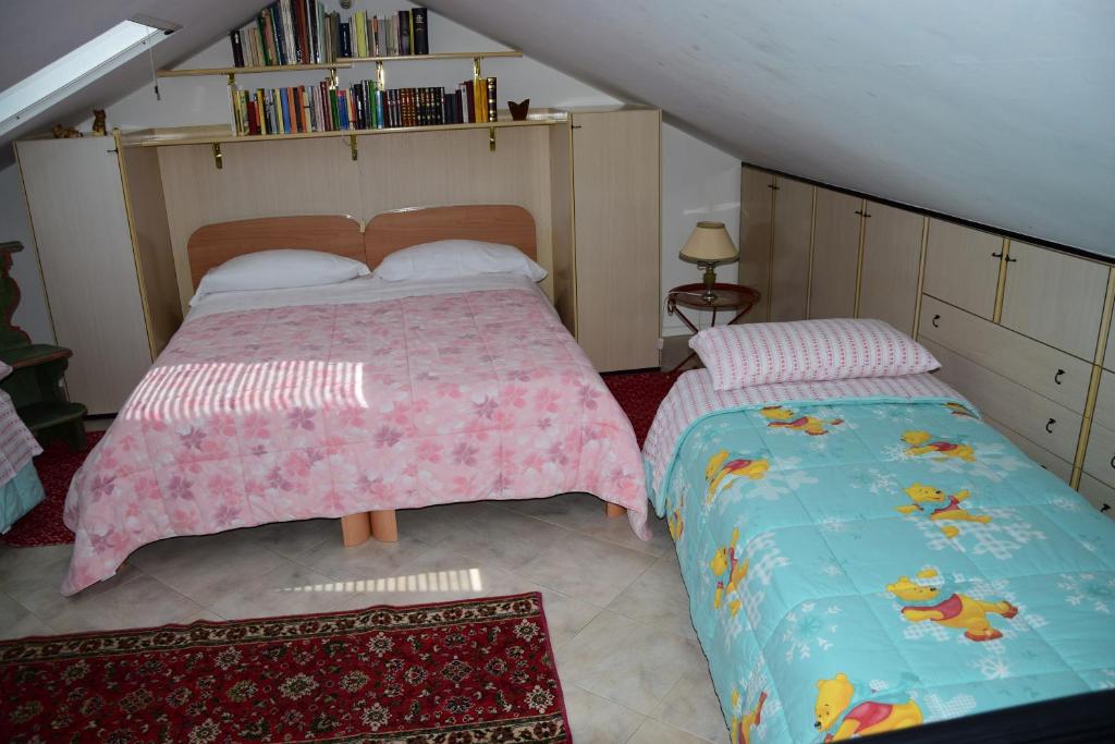 Postel nebo postele na pokoji v ubytování B&B Il Glicine Fiorito
