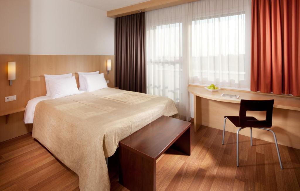 Postel nebo postele na pokoji v ubytování Comfort Hotel Olomouc Centre