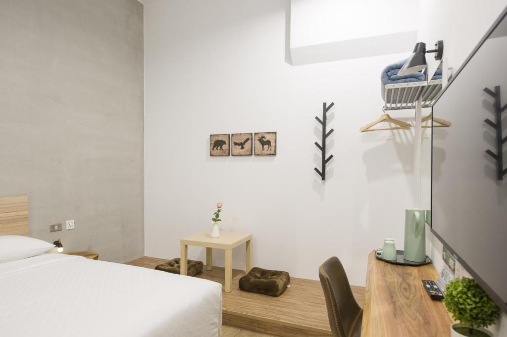 Voodi või voodid majutusasutuse OX Suites toas